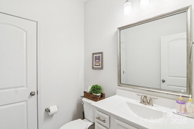 15108 Autumn Sage Dr, Charlotte, NC 28278 - half bathroom featuring vanity and toilet