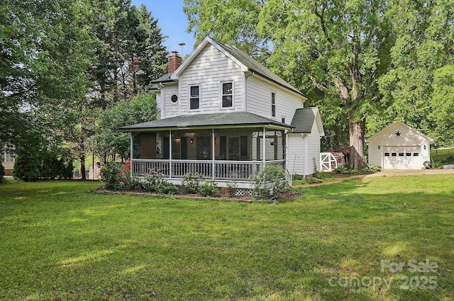 farmhouse with a front yard, a sunroom, an outdoor structure, a detached garage, and a chimney