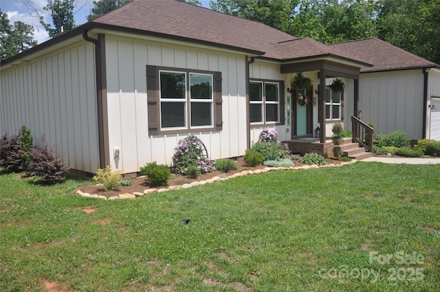 5817 Wingate Hill Rd, Denver, NC 28037 - view of front of home with board and batten siding, a front yard, and a shingled roof