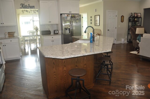 5817 Wingate Hill Rd, Denver, NC 28037 - kitchen featuring stainless steel fridge with ice dispenser, a sink, backsplash, dark wood finished floors, and crown molding