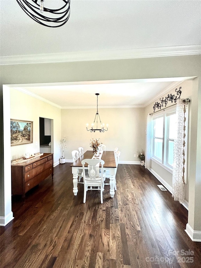 5817 Wingate Hill Rd, Denver, NC 28037 - dining area with a chandelier, dark wood finished floors, baseboards, and ornamental molding