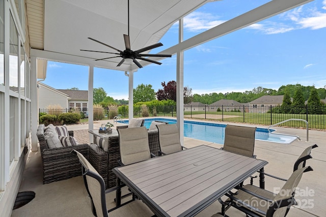view of swimming pool featuring a fenced backyard, a patio area, a ceiling fan, and a fenced in pool