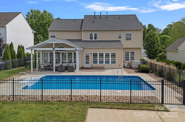 view of pool featuring fence, an outdoor hangout area, a fenced in pool, and a patio