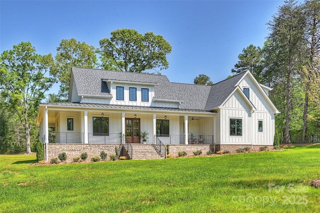 modern inspired farmhouse with board and batten siding, a standing seam roof, metal roof, roof with shingles, and a front lawn