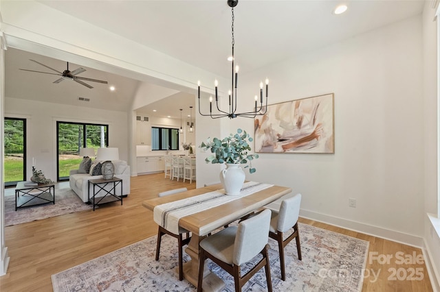 dining area with visible vents, light wood-type flooring, recessed lighting, and ceiling fan with notable chandelier