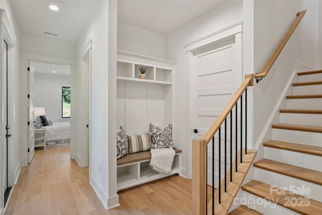 mudroom with recessed lighting and light wood finished floors