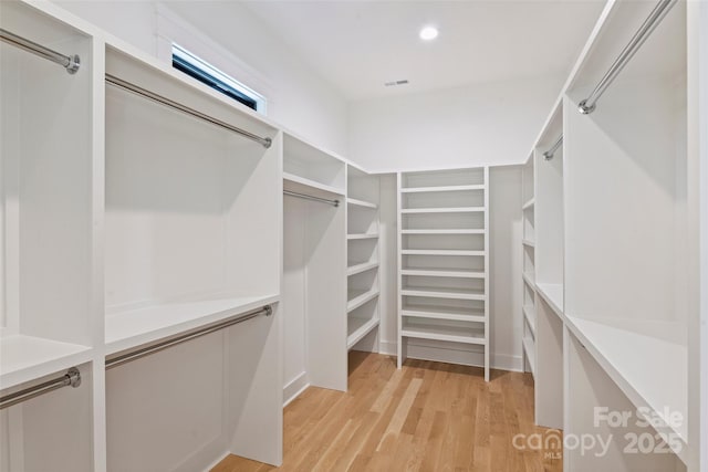 walk in closet with visible vents and light wood-style flooring