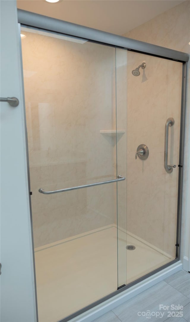 full bathroom with a shower stall