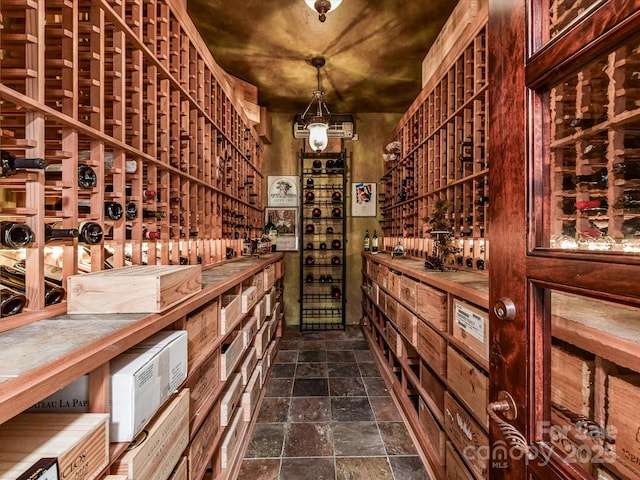 wine area featuring stone tile flooring