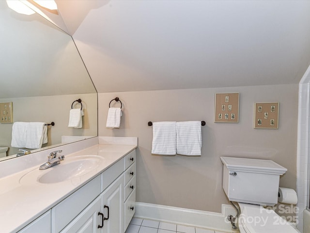 full bath featuring tile patterned flooring, vanity, toilet, baseboards, and lofted ceiling