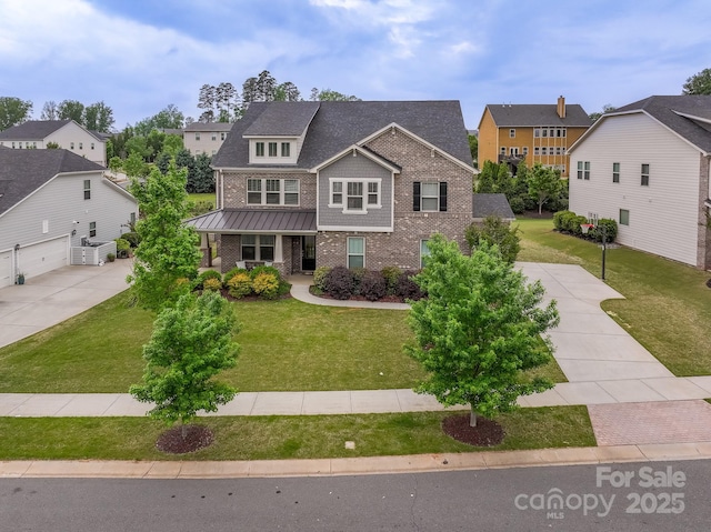 16711 Monocacy Blvd, Huntersville, NC 28078 - craftsman inspired home featuring a front lawn, covered porch, a residential view, and brick siding