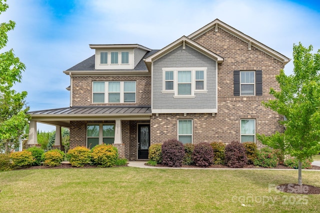 16711 Monocacy Blvd, Huntersville, NC 28078 - craftsman-style house with brick siding, a standing seam roof, and a front yard