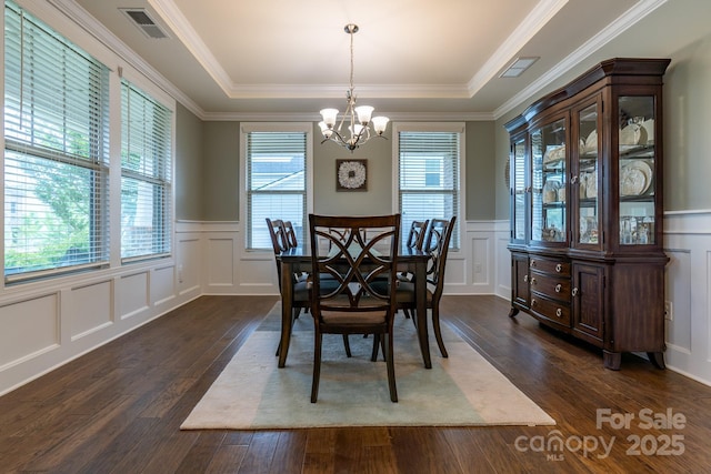 16711 Monocacy Blvd, Huntersville, NC 28078 - dining room featuring a chandelier, a decorative wall, and dark wood-type flooring