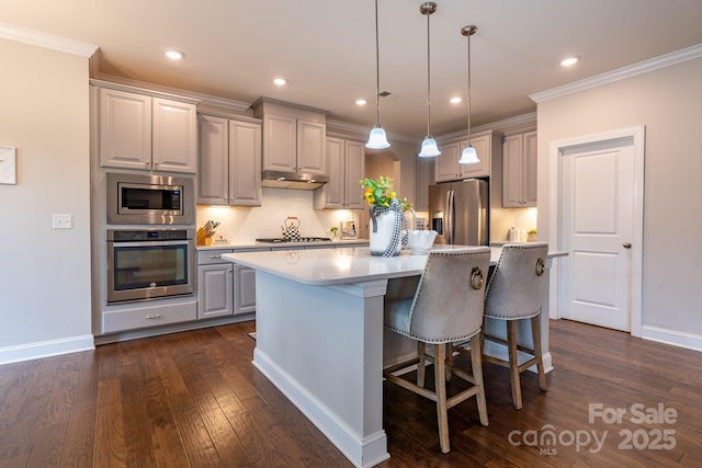 16711 Monocacy Blvd, Huntersville, NC 28078 - kitchen with stainless steel appliances, light countertops, a kitchen island, dark wood finished floors, and gray cabinets