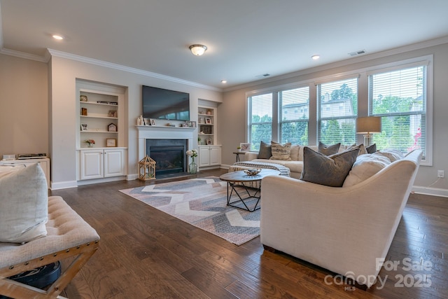 16711 Monocacy Blvd, Huntersville, NC 28078 - living area with a fireplace with flush hearth, built in shelves, visible vents, baseboards, and dark wood finished floors