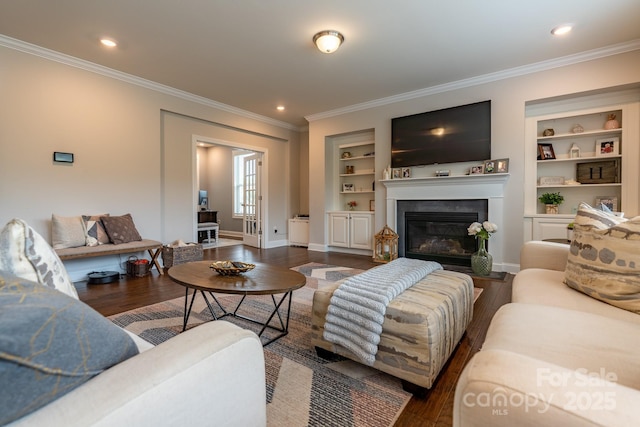 16711 Monocacy Blvd, Huntersville, NC 28078 - living room with a glass covered fireplace, wood finished floors, ornamental molding, and built in shelves