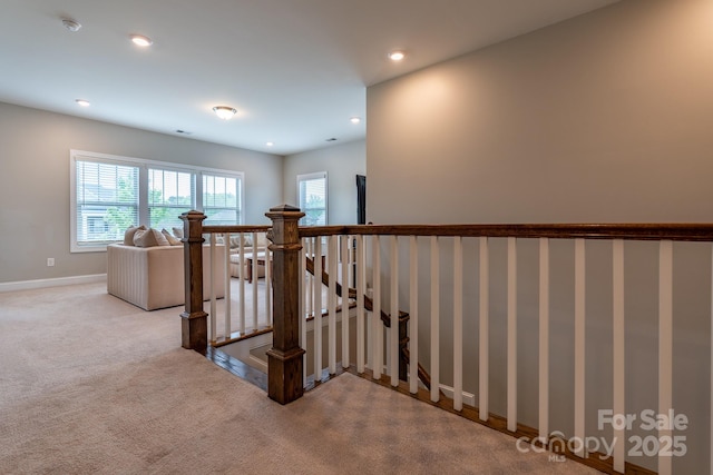 16711 Monocacy Blvd, Huntersville, NC 28078 - staircase featuring a healthy amount of sunlight, recessed lighting, carpet flooring, and baseboards