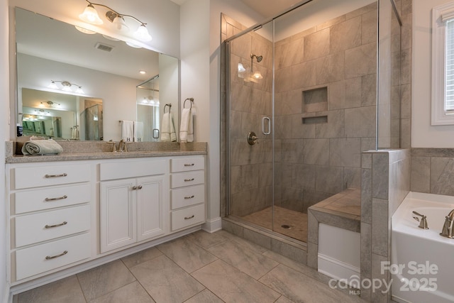 16711 Monocacy Blvd, Huntersville, NC 28078 - full bathroom with a bath, visible vents, a shower stall, and vanity