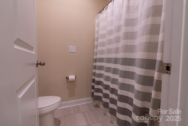 16711 Monocacy Blvd, Huntersville, NC 28078 - full bath featuring toilet, tile patterned floors, and a shower with shower curtain