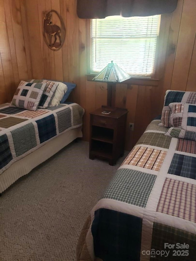 134 Raven Rdg, Maggie Valley, NC 28751 - bedroom featuring wood walls, multiple windows, and carpet flooring