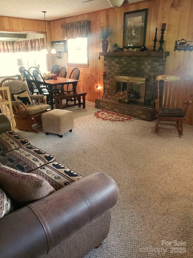 134 Raven Rdg, Maggie Valley, NC 28751 - carpeted living room with wooden walls and a brick fireplace
