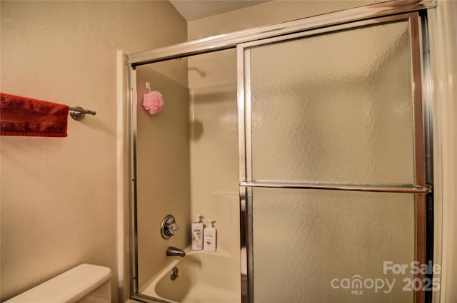 134 Raven Rdg, Maggie Valley, NC 28751 - bathroom with enclosed tub / shower combo and toilet