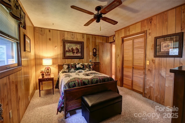 134 Raven Rdg, Maggie Valley, NC 28751 - carpeted bedroom featuring wooden walls, a closet, and ceiling fan