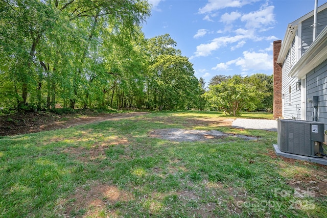 view of yard featuring central AC