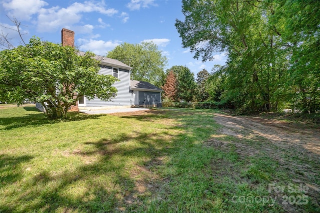 view of yard featuring a garage