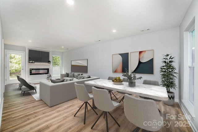 1640 English Knoll Dr, Matthews, NC 28105 - living area featuring light wood finished floors, recessed lighting, and a large fireplace