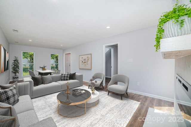 1640 English Knoll Dr, Matthews, NC 28105 - living room featuring wood finished floors, baseboards, and recessed lighting