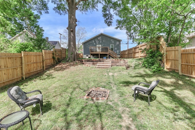 view of yard with a deck and stairway