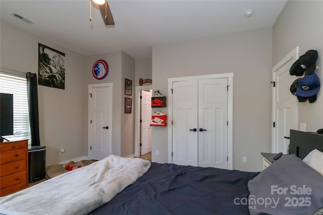 bedroom with ceiling fan and a closet