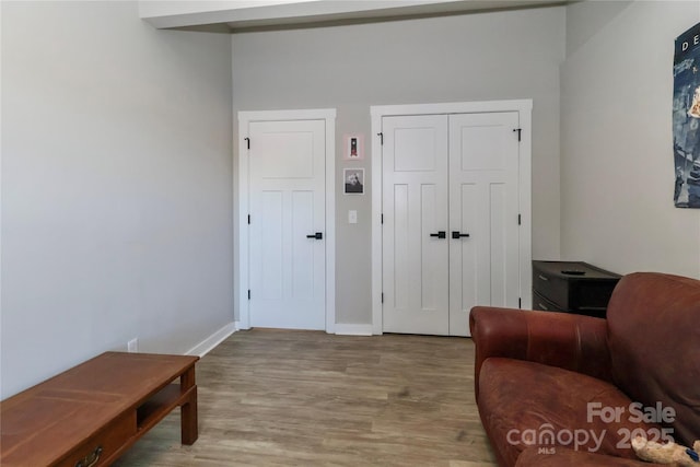 sitting room featuring wood finished floors and baseboards