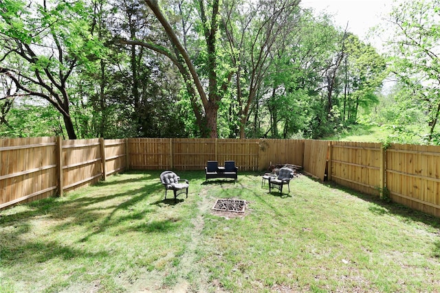 view of yard featuring a fire pit