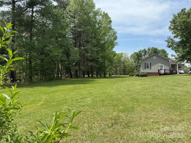 view of yard with a deck