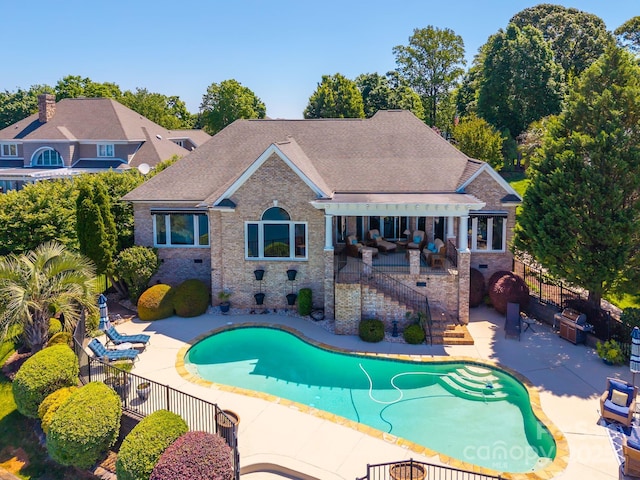3507 Governors Island Dr, Denver, NC 28037 - exterior space featuring a patio area, brick siding, a fenced in pool, and fence
