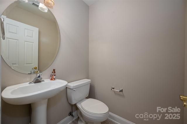 2412 Laura Dr, Charlotte, NC 28212 - bathroom featuring toilet and baseboards