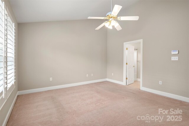 2412 Laura Dr, Charlotte, NC 28212 - carpeted empty room featuring baseboards, high vaulted ceiling, and ceiling fan