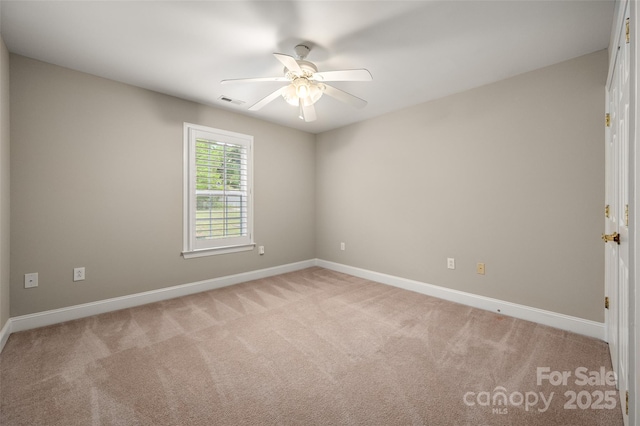2412 Laura Dr, Charlotte, NC 28212 - spare room featuring light colored carpet, ceiling fan, and baseboards