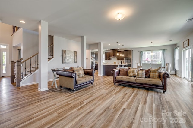 14925 Baldridge Dr, Huntersville, NC 28078 - living room with stairway, light wood-type flooring, baseboards, and recessed lighting