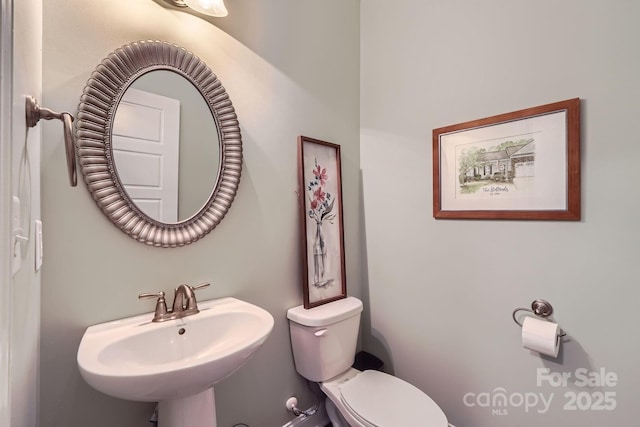 bathroom with a sink and toilet
