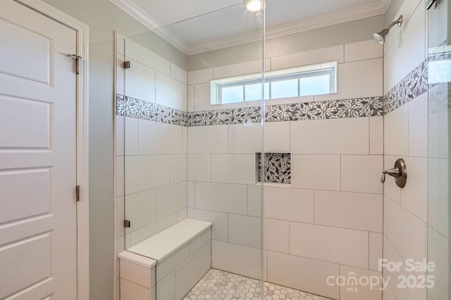 bathroom featuring tile patterned floors, ornamental molding, and a stall shower