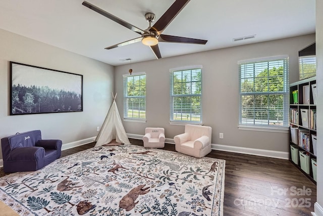 bedroom featuring visible vents, baseboards, and dark wood-type flooring