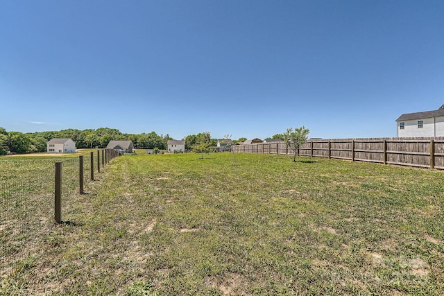 view of yard with fence