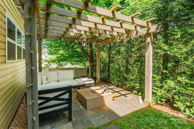 view of patio featuring outdoor lounge area and a pergola