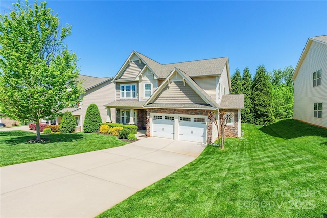 craftsman house featuring a garage, a front lawn, concrete driveway, and stone siding