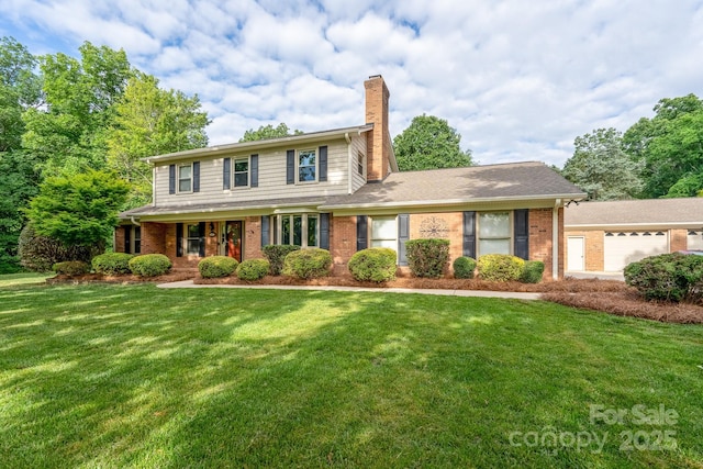 traditional home with a chimney, a front yard, and brick siding