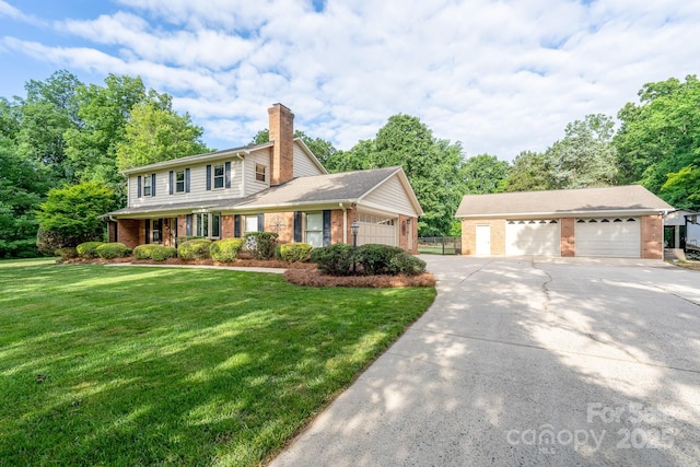 4145 Wrangler Dr SW, Concord, NC 28027 - traditional home with brick siding, a chimney, a garage, driveway, and a front yard