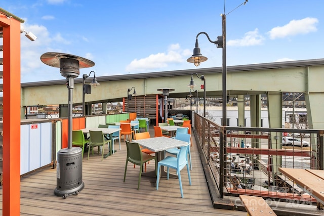 deck with outdoor dining area